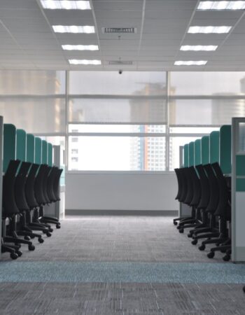 A row of grey cubicles