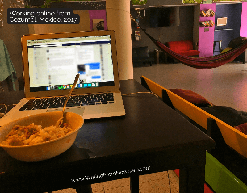 Laptop sitting on table in Mexico with a hammock in the background